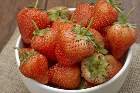 Fresh strawberries on old wooden backgroundの写真素材