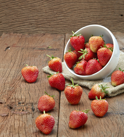 Fresh strawberries on old wooden backgroundの写真素材