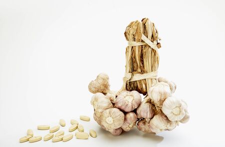Garlic condiment on white backgroundの写真素材
