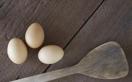 Fresh eggs cooking breakfast to put on old woodの写真素材