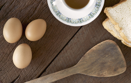 Fresh eggs cooking breakfast to put on old woodの写真素材