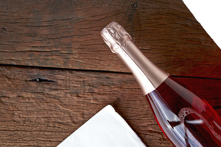 bottle flavoured fruit wine on woodの写真素材