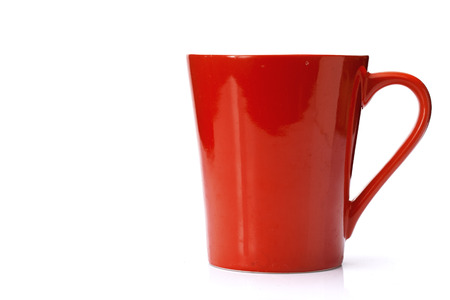 Red ceramic glass is placed on a white background.の写真素材