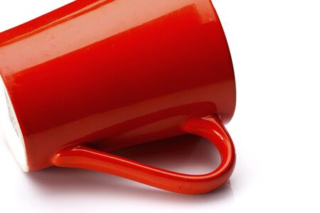 Red ceramic glass is placed on a white background.の写真素材