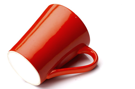 Red ceramic glass is placed on a white background.の写真素材