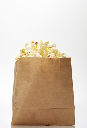 Popcorn in box isolated on white backgroundの写真素材