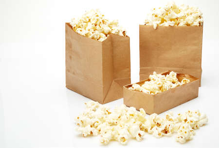 Popcorn in box isolated on white backgroundの写真素材