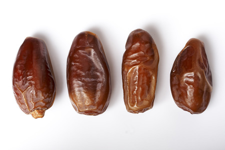 dates fruit isolated on white backgroundの写真素材