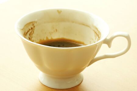 coffee cup On The wood Table by the window with ornaments empty.の写真素材