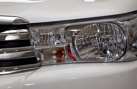 Closeup headlights of car.