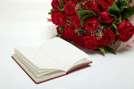 A bouquet of red roses with notesの写真素材
