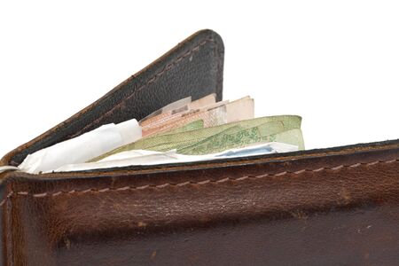 brown wallet with money on a white background.