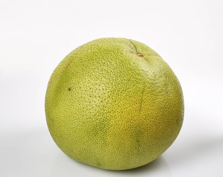 Green pomelo citrus fruit with cut isolated on White. stack