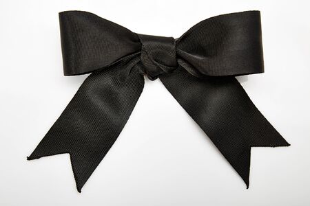 Black bow on whiteの写真素材