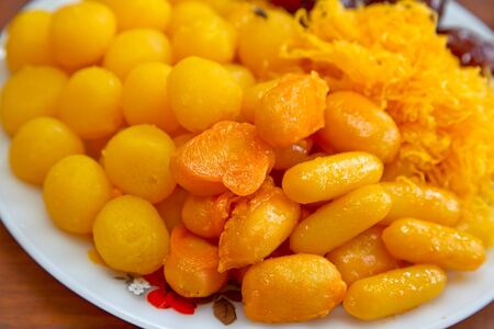 thai dessert, thai sweets on a wooden tableの写真素材