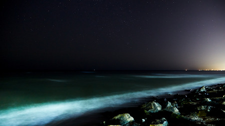 Stars with sandy beach at nightの写真素材