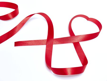Red heart ribbon, on white backgroundの写真素材