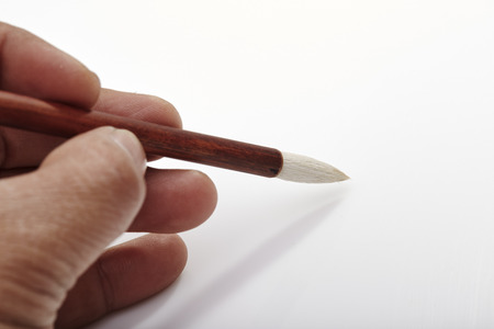writing brush in man's handの写真素材