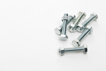 Nuts and bolts isolated on white backgroundの写真素材