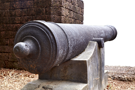 Ancient cannon and old wall in Thailand.の写真素材