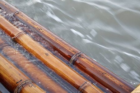 bamboo rafts floating in a lake, waterの写真素材