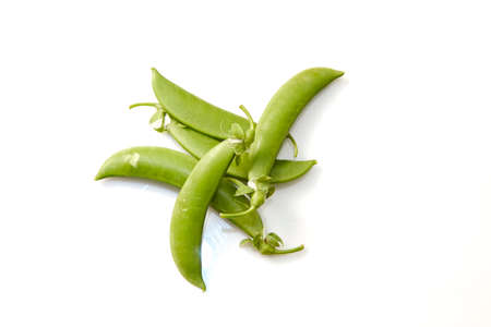 Snow peas isolated over white backgroundの写真素材