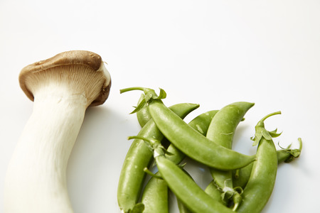 Peas with mushrooms and cookの写真素材