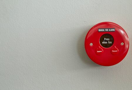 Red fire alarm isolated on white backgroundの写真素材