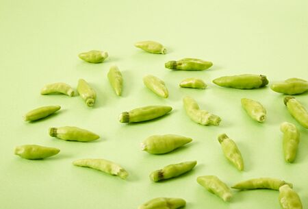 Fresh chili's on a green tableの写真素材