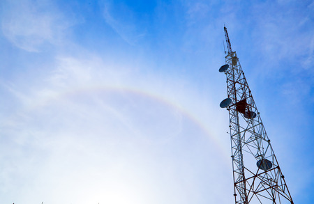 Large transmission tower against sky