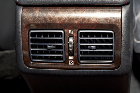 Cropped Image of a passenger air vents wood in a luxury vehicleの写真素材