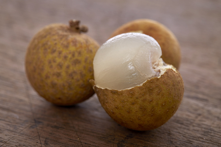 Fresh Longan on a wooden background,Local Thai Fruitsの写真素材