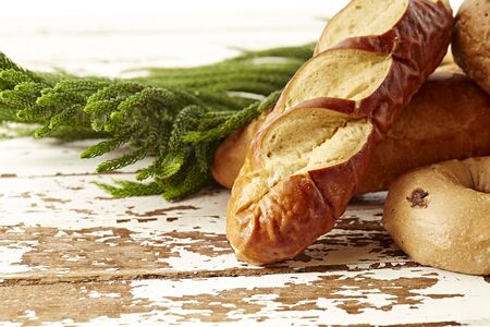 Different bread on table on white background