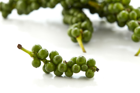 Green peppers so fresh on white backgrounの写真素材
