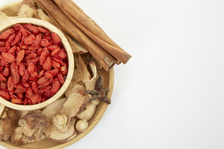 Cinnamon, star anise, cardamom, galangal,  on a white background.の写真素材