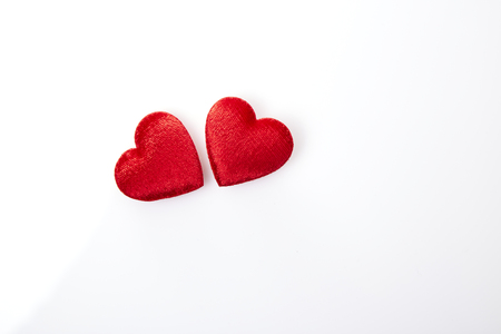 Two red hearts isolated on white background ,copy space availableの写真素材