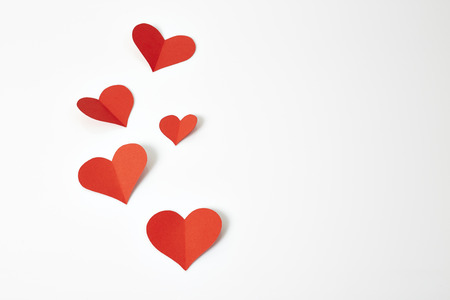 Red paper hearts isolated on white backgroundの写真素材