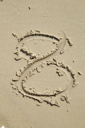 Numbers written on the sand for use in such things.の写真素材