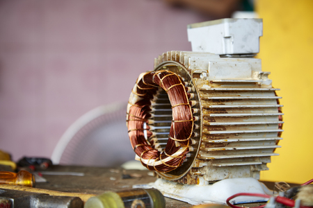 Repair Old disassemble electric motor show wiring coil during replace bearingの写真素材