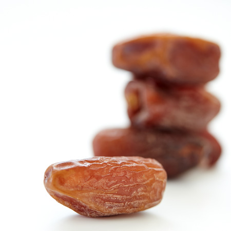 Dried dates isolated on a white backgroundの写真素材