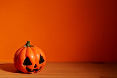 halloween holiday concept. cute pumpkins on wooden tableの写真素材