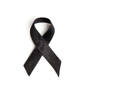 Black ribbon isolated on white. Melanoma and mourning conceptの写真素材