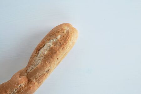 French bread baguette on a table white background. Top view with space for your textの写真素材