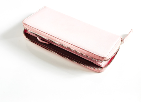 Woman pink purse isolated on the white background Top view on the walletの写真素材