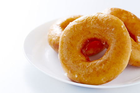 Donut isolated on a white plate in white backgroundの写真素材