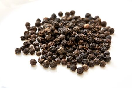 Black pepper was placed on a white background
