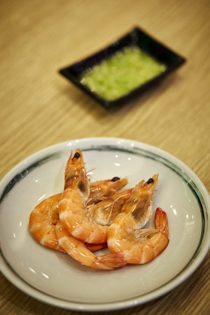 Cooked Whole Shrimps served in a dish on the wood tableの写真素材