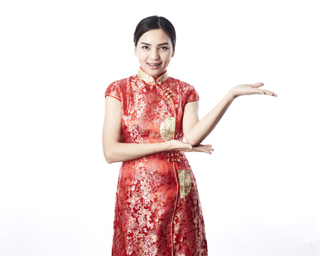 Beauty woman wear cheongsam and smile to you in Chinese new yearの写真素材
