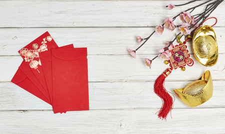 Chinese new year festival decorations , the chinese character on the gold ingots means fortune and luckの写真素材