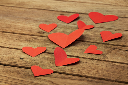 Red heart paper on wooden background, valentine's day and romance conceptの写真素材